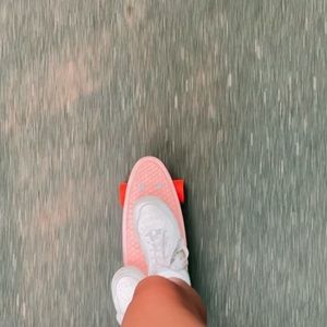 Orange and pink penny board